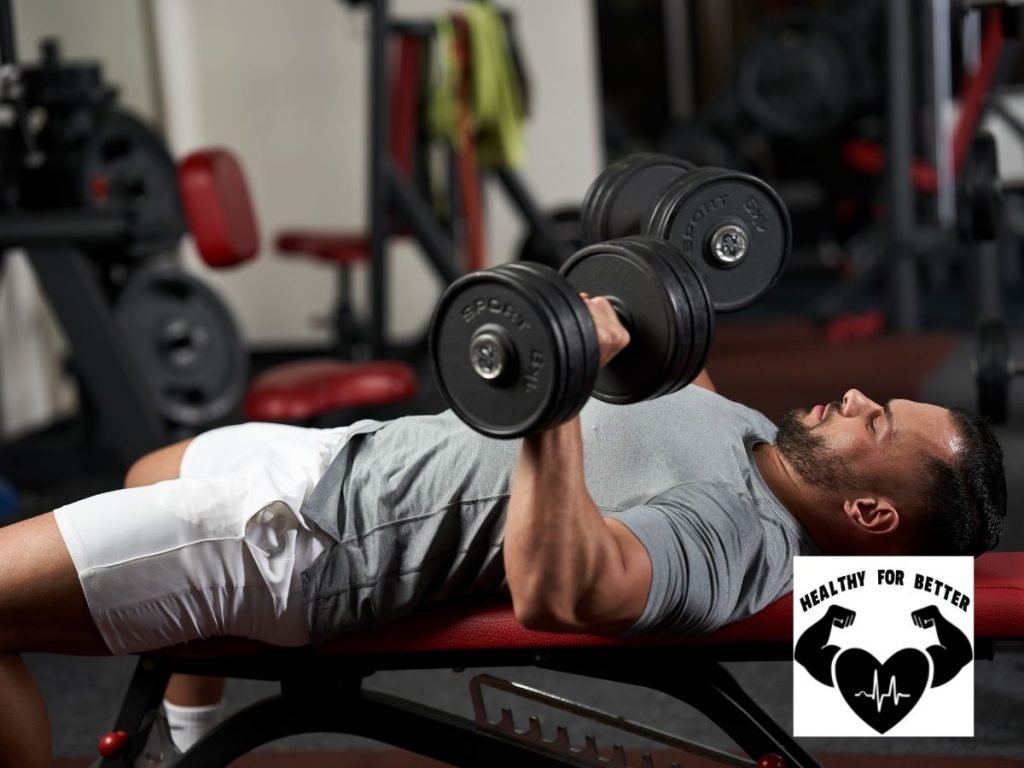 man lifting dumbbells